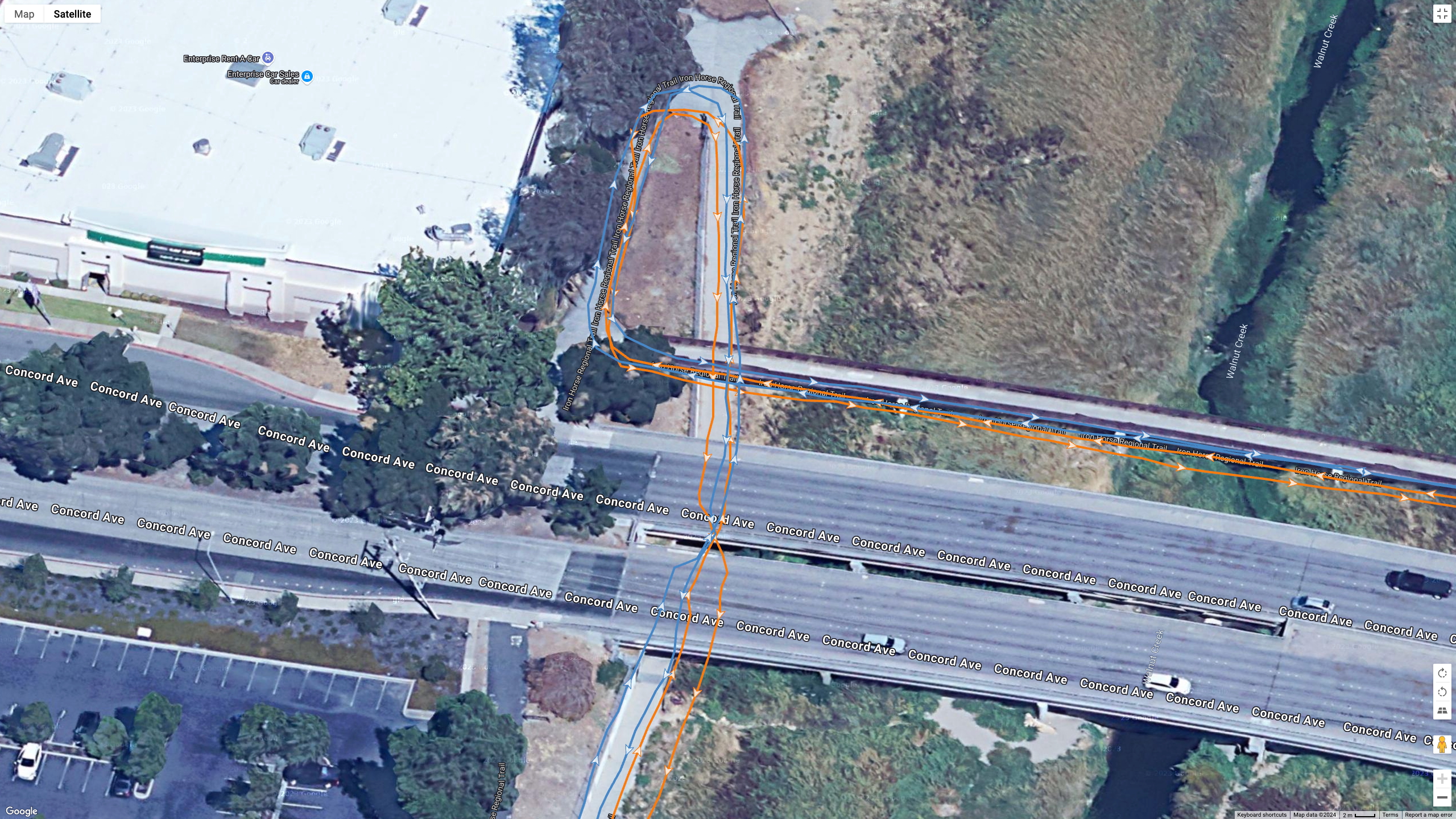 A Google Maps satellite view showing how the Polar Vantage M3 (orange line) and Garmin Fenix 8 (blue line) compared for GPS accuracy during a run.