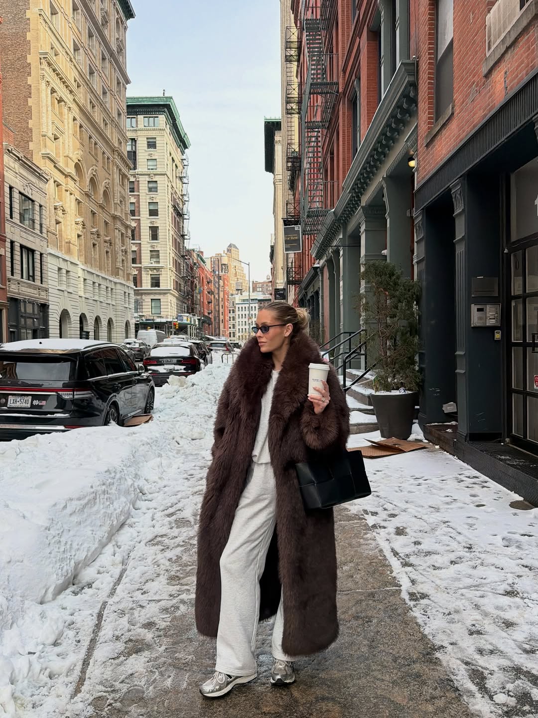 woman wearing brown faux fur coat 2026