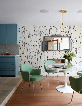 Open plan kitchen diner with wallpaper