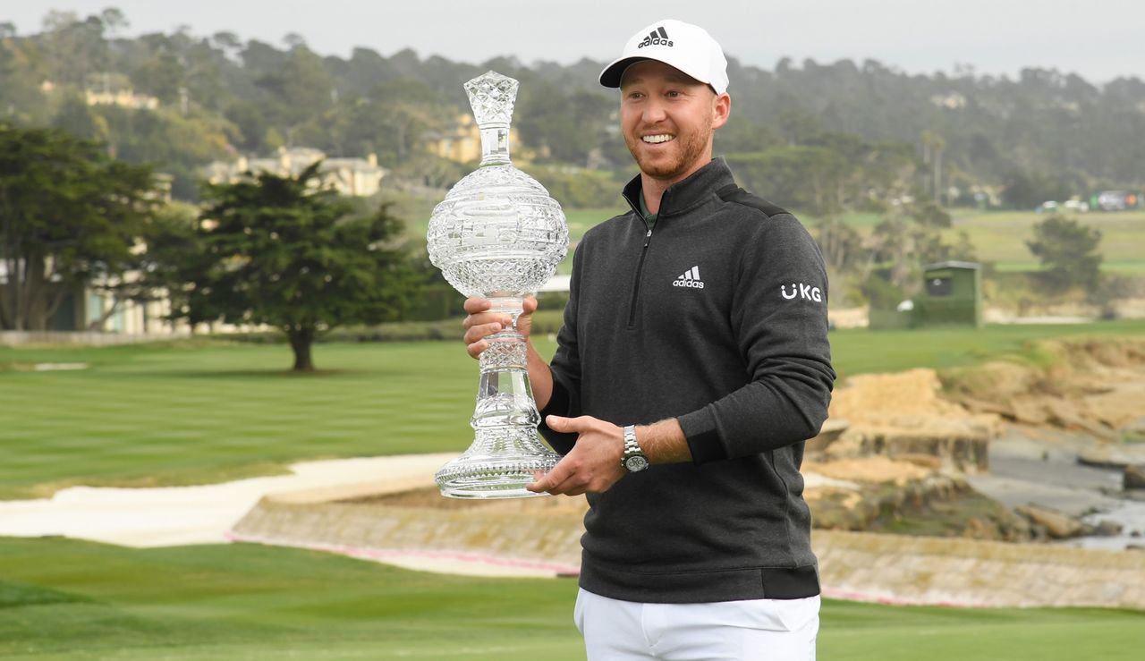 Berger holds the trophy