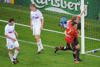 David Villa and Fernando Torres celebrate a goal for Spain against Russia in the teams' group game at Euro 2008.