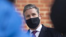 Keir Starmer visits a building wrapped in unsafe cladding.