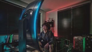 A man looking at the Samsung Odyssey Ark in vertical mode