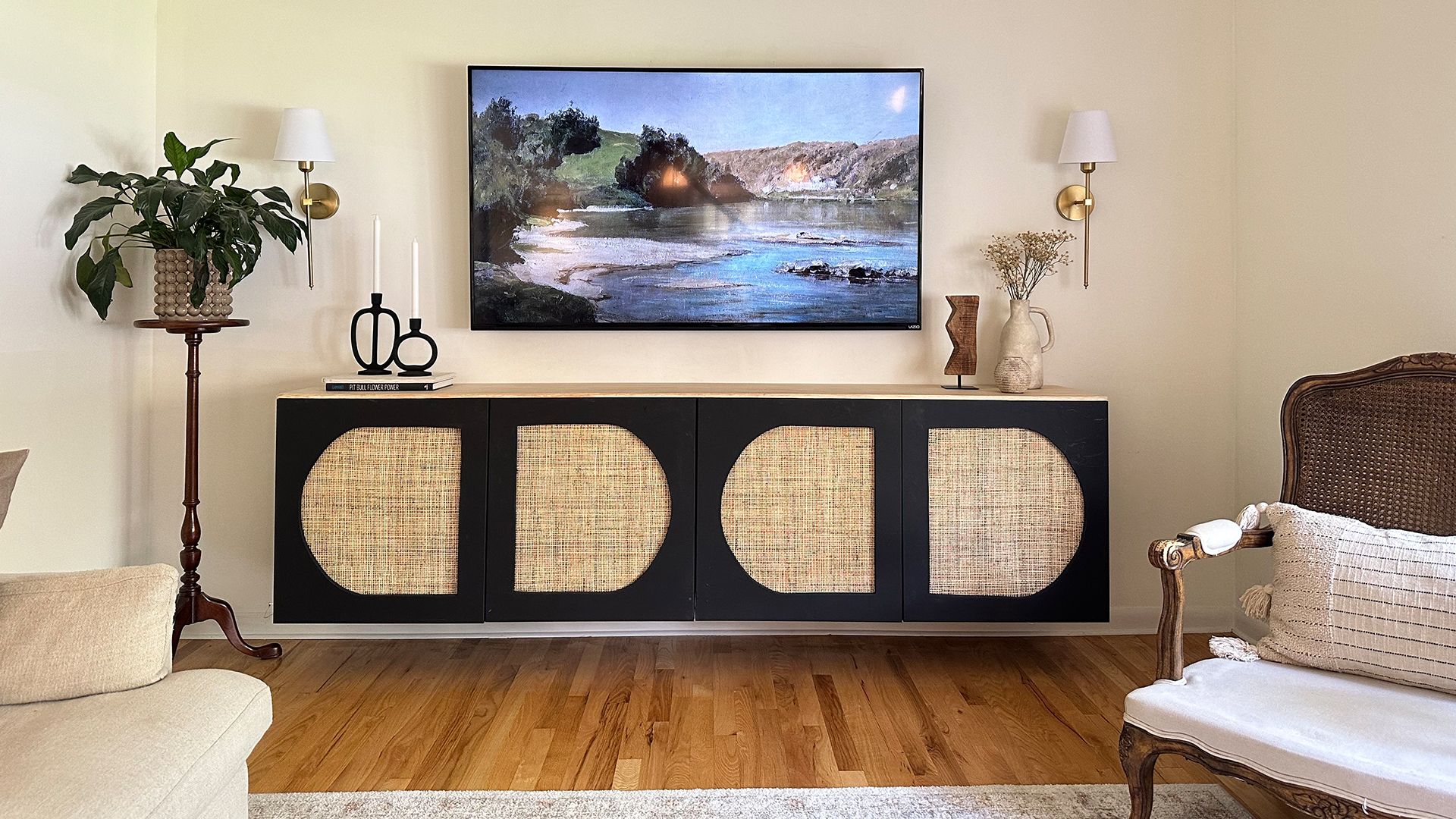 Black long cabinet with cane panelled doors