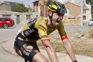 David Dekker (Jumbo-Visma) winces after crashing at high speed in the final kilometre of stage 2 of the Vuelta a Burgos 2022