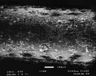 ZBLAN fibers processed on the ground have a tree-bark-like structure on the outside, whereas ZBLAN made in space doesn't show crystallization.