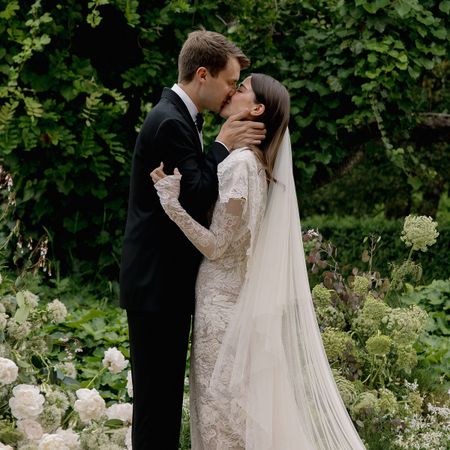 An image of abbie and max kissing at their wedding.