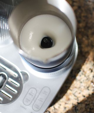 Mr. Coffee® 4-in-1 Single-Serve Latte™, Iced, and Hot Coffee Maker milk frother in action