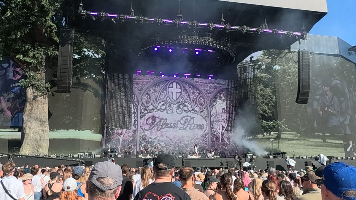 An Alessi rose concert stage with a crowd gathered in front.