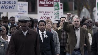 Kelvin Harrison Jr. as Martin Luther King Jr. in a crowd protesting in Genius: MLK/X episode 6