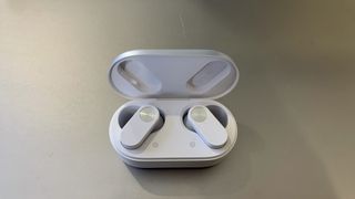 OnePlus Nord Buds 2 earbuds in their case, on gray background