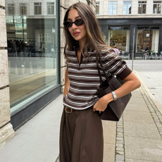 woman wearing striped polo top outfit