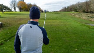 PGA pro Dan Hendriksen standing behind his ball eyeing up his shot