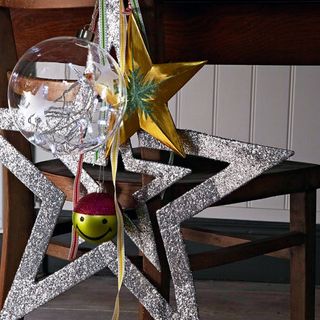 dining chair with christmas stars and decoration