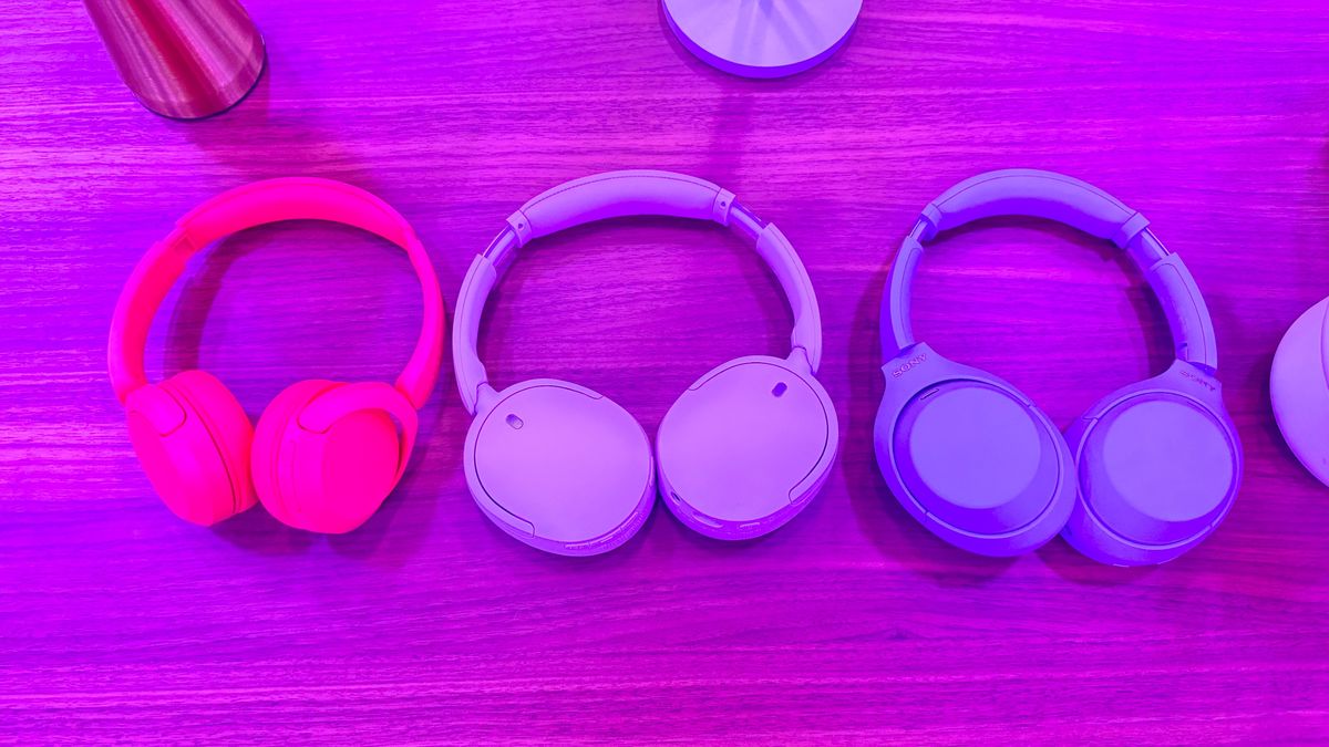 Sony WH-CH730N wireless headphones in lavender on a wooden table