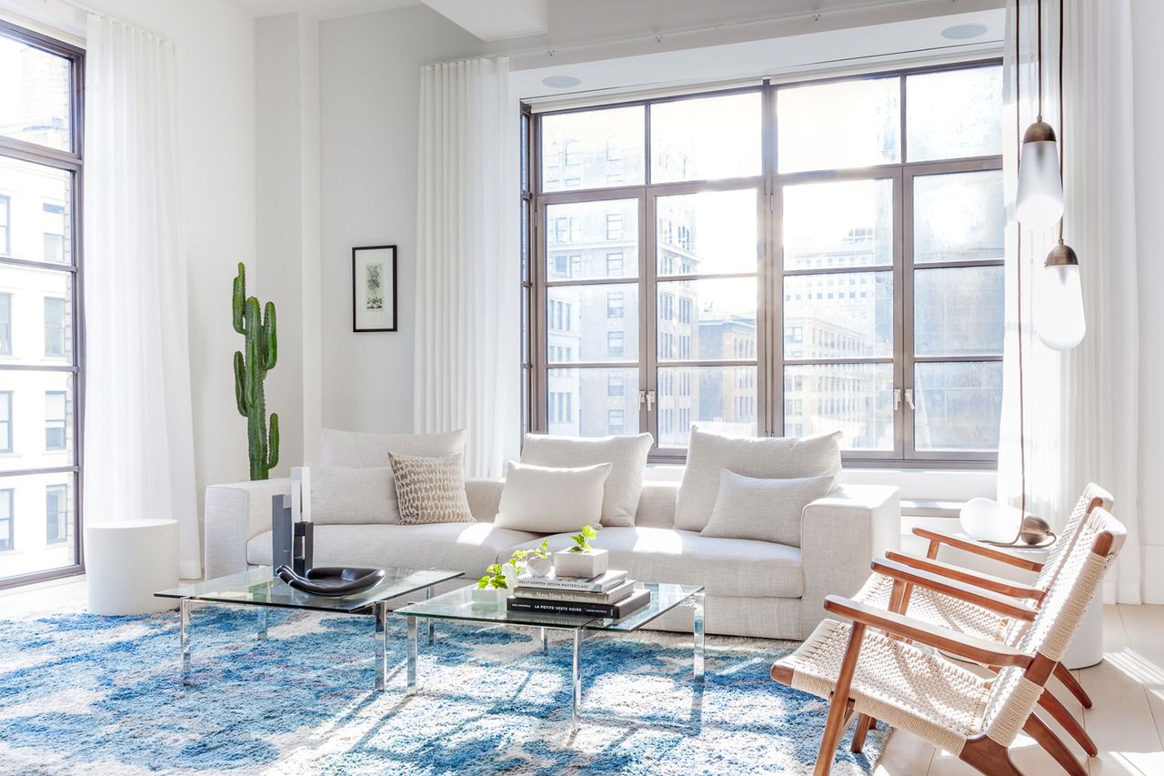 a large loft apartment with big windows