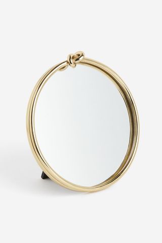 Gold knot detail table mirror from H&M home.