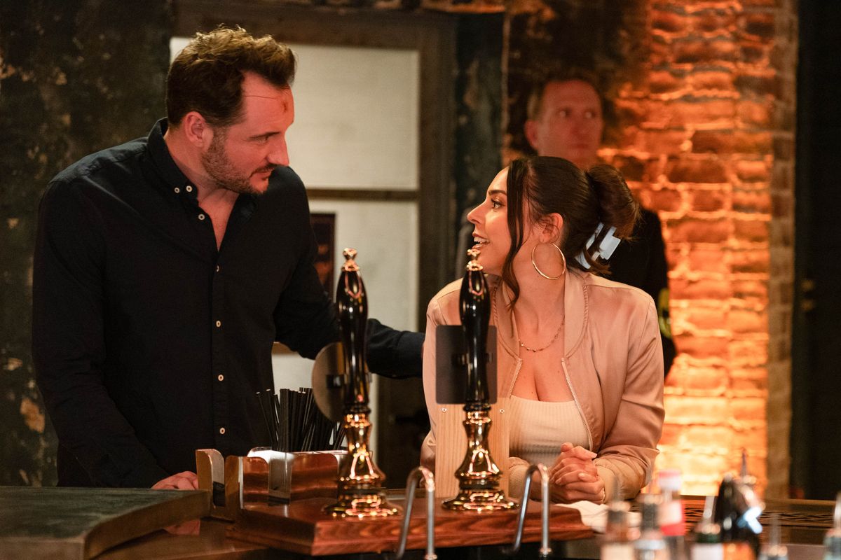 Martin Fowler stands next to Priya Nandra-Hart at the bar in Peggy&#039;s as they flirt with each other