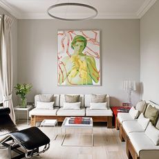living room with wall painting on grey wall