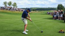 bryson dechambeau hitting a drive at LIV Golf London