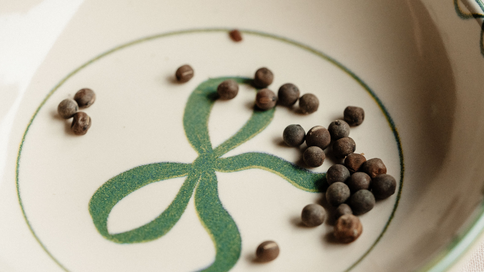 close up of sweet pea seeds in ceramic dish
