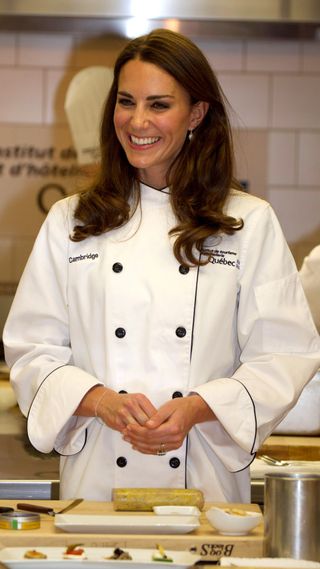 Kate Middleton wearing a white chef's jacket