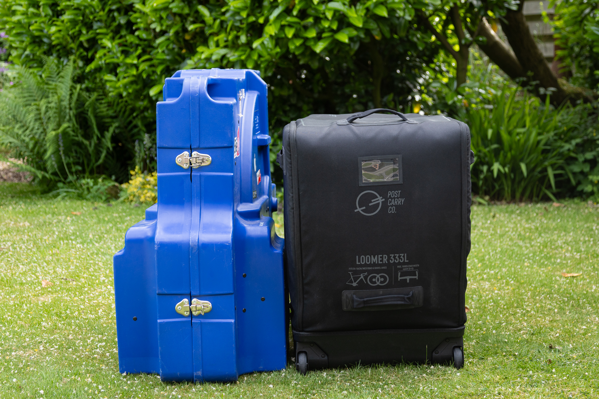 front view of a black Loomer and a blue Bike Box Alan