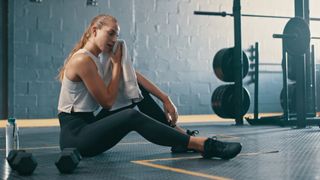 A woman resting in the gym