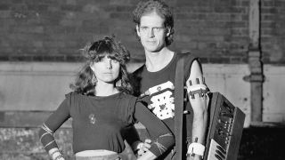 Singer Barbara Gaskin and keyboard player Dave Stewart, London, 1982. Stewart is holding a Korg synthesizer and wearing several torches strapped to his arm. (Photo by Michael Putland/Getty Images)