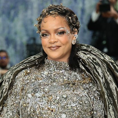Rihanna at the met gala before she changed into the high vamp flats trend