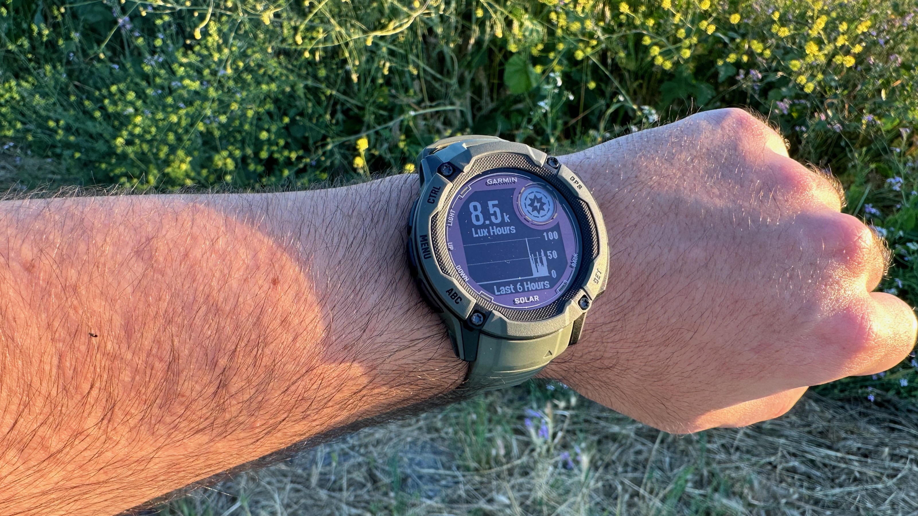 The Garmin Instinct 2X Solar worn at sunset, showing the lux hours picked up by the watch's solar panel in the last six hours.
