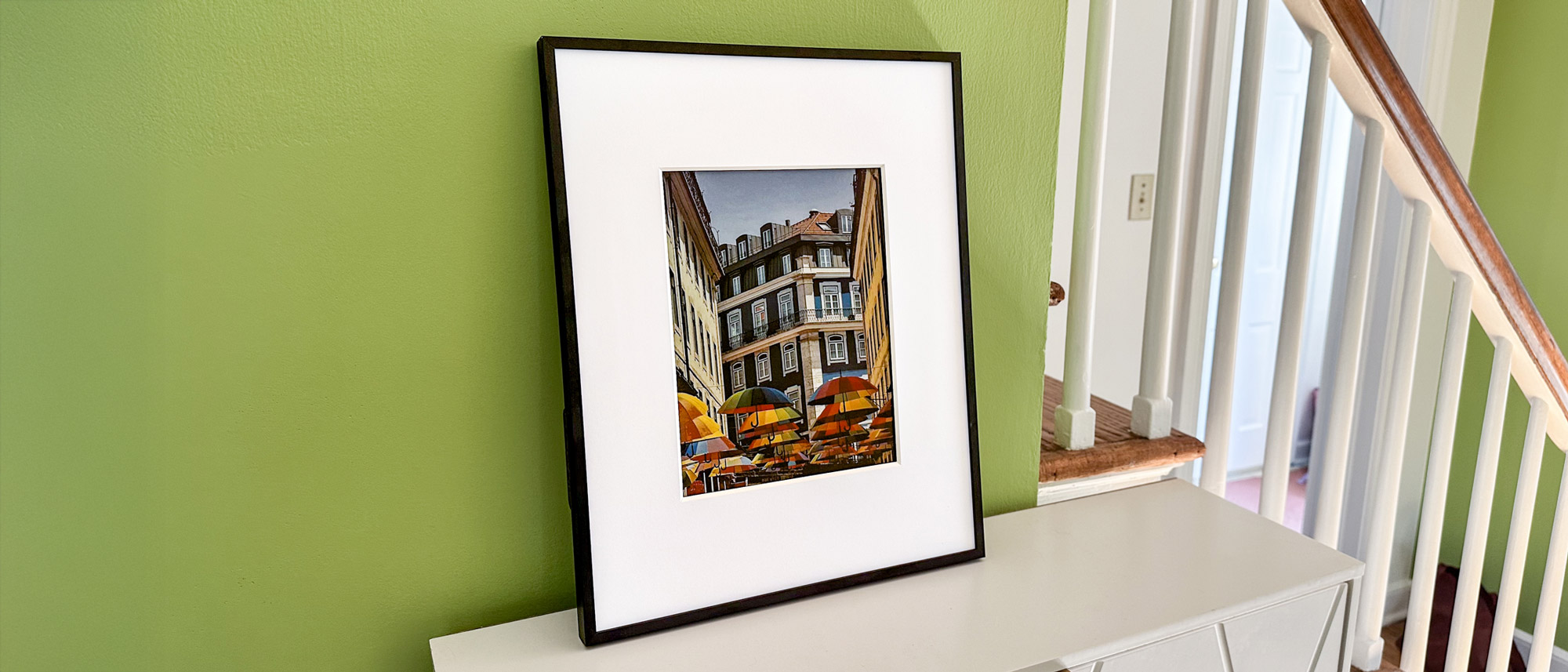 Aluratek ePaper 13.3 inch Wifi Digital Photo Frame on a shelf
