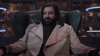 Laszlo sitting in arm chair in What We Do in the Shadows Season 6