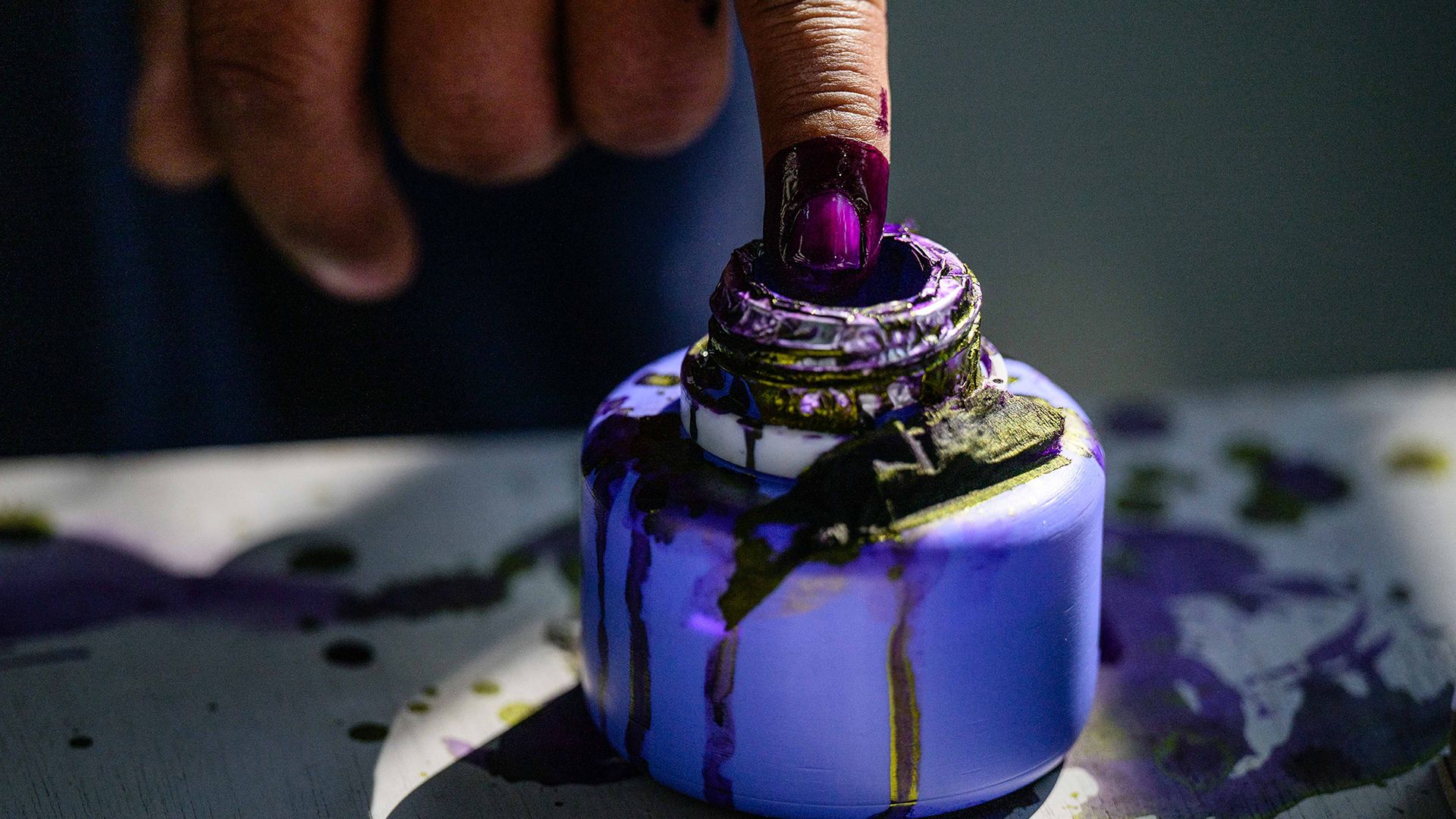 
                                A voter inks their finger after casting a ballot at a polling station during Myanmar's general election in Mandalay
                            