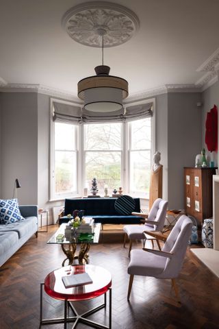 large grey living room with roman blinds
