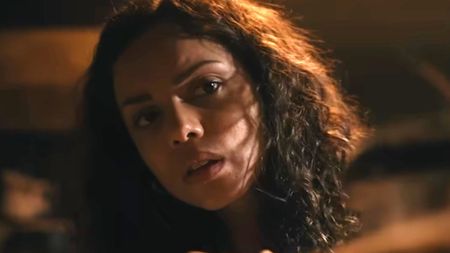 Georgina Campbell peeking around a corner in Barbarian