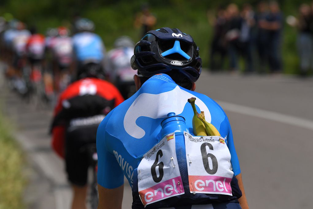 A Movistar riders stocks up for stage 15 at the Giro