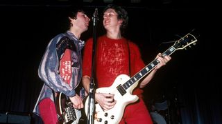 Photo of Steve JONES and Glen MATLOCK and SEX PISTOLS; Glen Matlock & Steve Jones performing live onstage at Dunstable's Queensway Hall