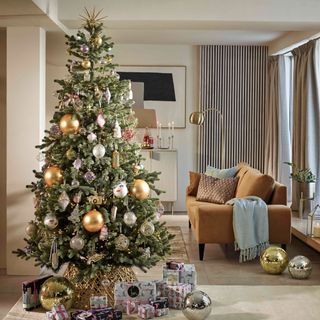 large decorated christmas tree in white living room