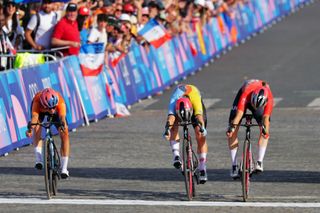 04/08/2024 - Paris 2024 Olympic Games - Cycling Road - Trocadero-Trocadero (158.0km) - Paris, France - Women’s Road Race - Marianne Vos (Netherlands) sprints to second place with Lotte Kopecky (Belgium) finishing third and Blanka Vas (Hungary) in fourth