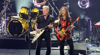 James Hetfield and Kirk Hammett rock the crowd at their All Within My Hands fundraiser show in Inglewood, CA. Hetfield plays his legendary white Flying V copy, while Hammett plays his ESP "Mummy" KH Series signature model.