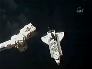 Shuttle Atlantis Arrives at Space Station