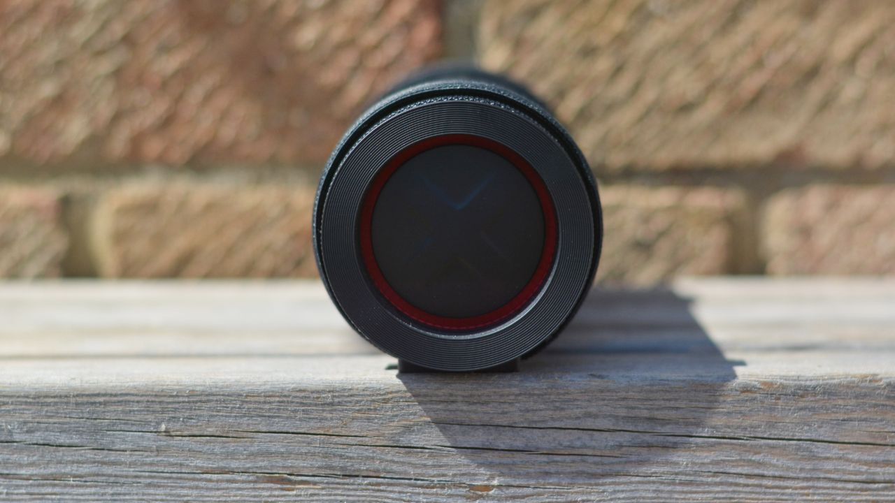 LG xboom Grab Bluetooth speaker in an outdoor setting