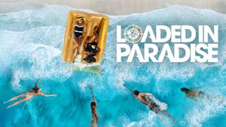 Loaded in Paradise season 2 key art. Four people swim towards two women lying on a gold lilo in the sea.