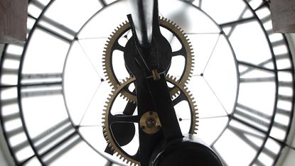 SINGAPORE - JULY 17:Details of the clock mechanism is seen inside the clock tower during the media preview of the Victoria Theatre and Concert Hall on July 17, 2014 in Singapore. The Victoria
