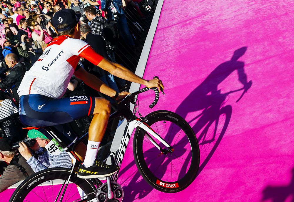 A rider takes the stage at the Giro team presentation.