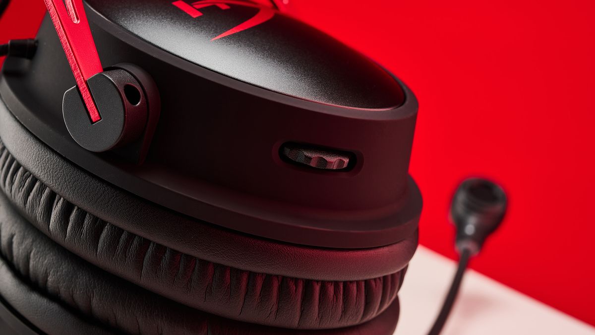 HyperX Cloud Alpha Wireless headphones on a red background