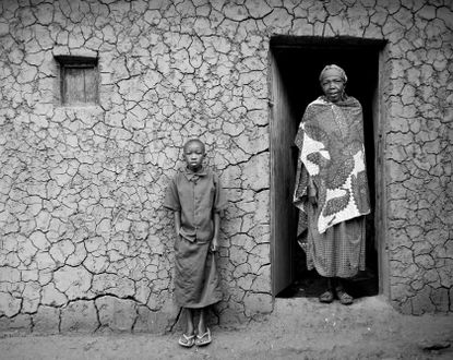 Photograph of Agnes Muhishire and her granddaughter from the series Toilet stories by Elena Heatherwick 