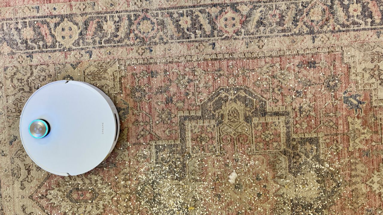 Dreame Matrix10 Ultra robot vacuum cleaning debris from a large rug