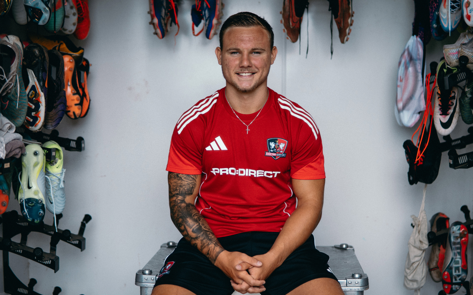 Jayden Wareham posing in the Exeter City home kit